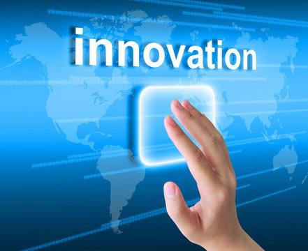 hand pushing innovation button on a touch screen interface