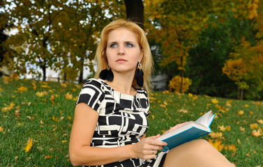 Girl with book in the park