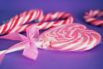 heart lollipop and candies with pink ribbon
