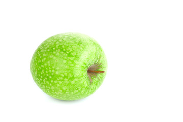 Isolated green apple spotted on a white background