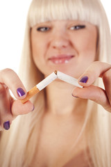 Young blond woman quitting smoking