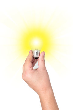 Light bulb with bright rays of the hand.