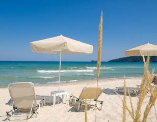Sunchairs and umbrella on Carribean Beach