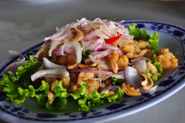 Deep fried crispy shrimp with pomeloes and shallots in spicy & l