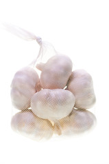 Bulbs of garlic in a bag vertical