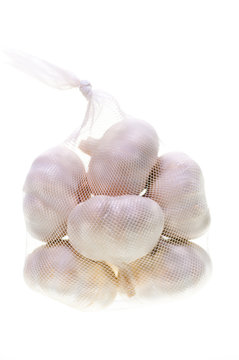 Bulbs of garlic in a bag vertical