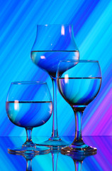 Three wineglasses on the mirror