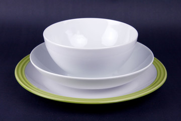 Set of crockery with bowl  and plate on black background