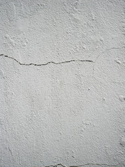 Cracked textured grey concrete wall background