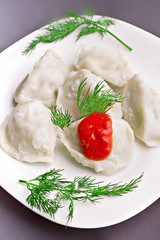 meat dumplings served on black plate