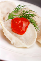 meat dumplings served on black plate