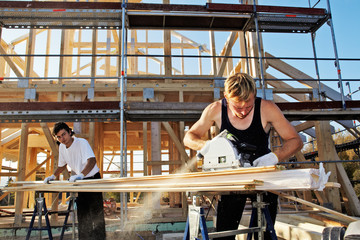 carpenters setting up prefabricated framework