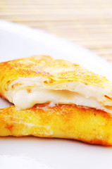 Custard filled pancake in plate