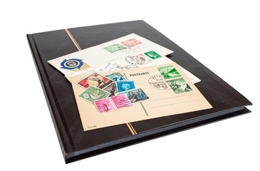 Fototapeta na wymiar Album of postage stamps isolated on white background