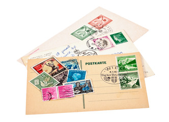 Fototapeta na wymiar Postage stamps and postage cards on white background