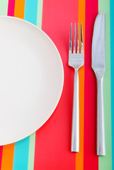 Empty plate with utensils