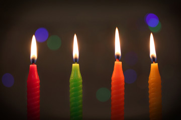 colorful candles on dark background