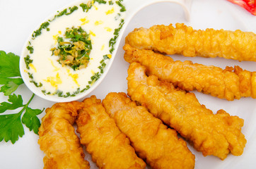 Battered chicken served with sauce