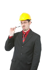 Nerdy looking engineer with pen in his nose