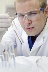 Male Scientist or Doctor With Test Tube In Laboratory