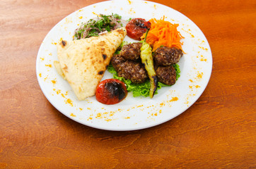 Meat cuisine - kebab served in plate