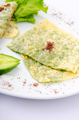Herb stuffed pancaces in the plate