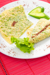 Pancake with herbs in the plate