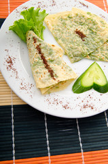 Pancake with herbs in the plate