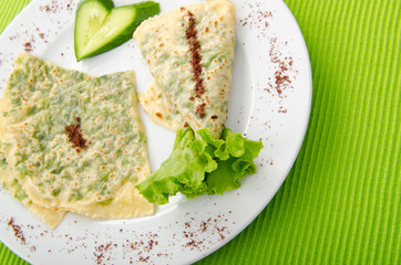 Pancake with herbs in the plate