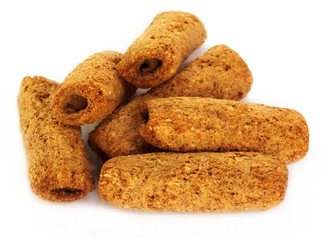 Rolled cookies over white background