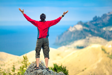 Man on top of mountain