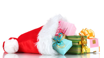 Beautiful Christmas hat and gifts isolated on white