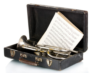 old trumpet and notebook with notes in case isolated on white © Africa Studio
