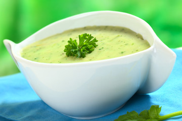 Spinach cream soup garnished with parsley