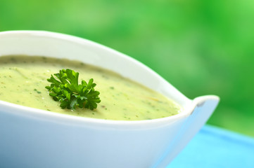 Spinach cream soup garnished with parsley