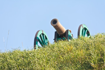 The old fashioned cannon on a hill
