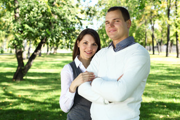 Fototapeta premium Young family with a child in summer park