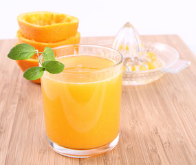 Orange juice freshly squeezed from fresh fruits with a juicer
