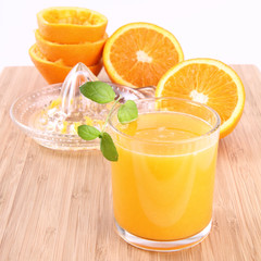 Orange juice freshly squeezed from fresh fruits with a juicer