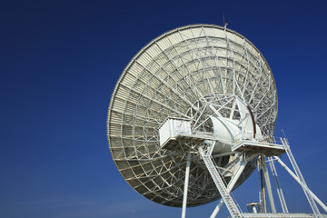 Radar dish with blue sky