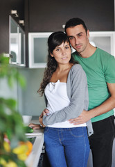 Naklejka premium young couple have fun in modern kitchen