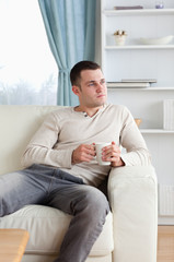 Portrait of a handsome man having a coffee