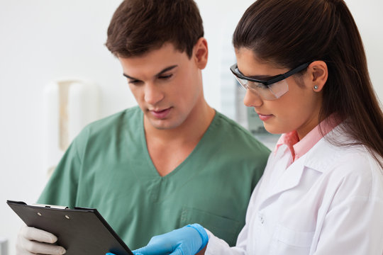 Dentist With Her Assistant