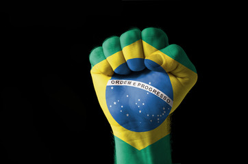 Fist painted in colors of brazil flag