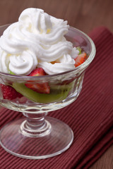 strawberries and kiwi on a table.