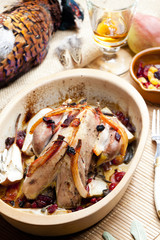 baked pheasant with bacon, pear, raisins on brandy