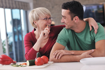 young couple have fun in modern kitchen