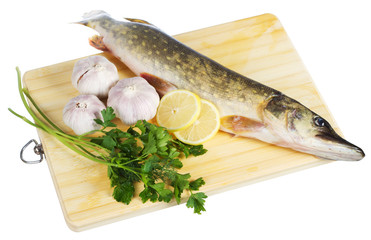 Raw pike with cooking ingredients