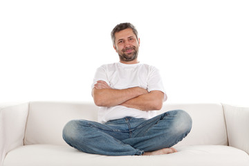 Fototapeta premium Casual man sitting on sofa