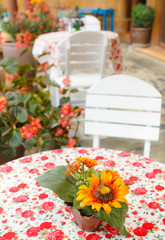 Fake flowers on table in coffee shop